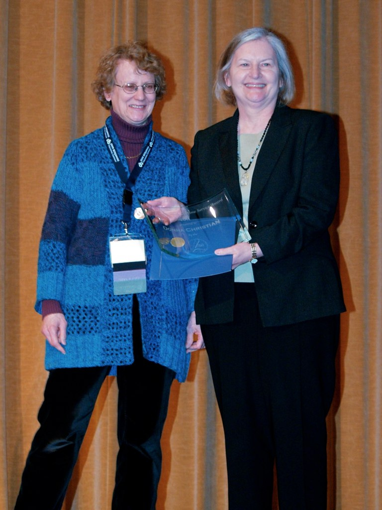 Donna Christian (right) poses with Sarah Thomason while accepting the Victoria A. Fromkin Prize
